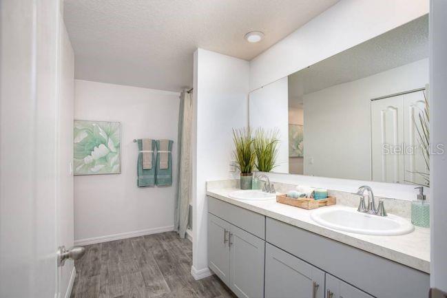 3392 East Odier Street Inverness, FL 34453 - Photo 14 of 24 a bathroom with a sink and a mirror