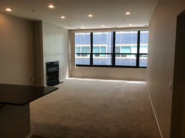 a view of an empty room with a window