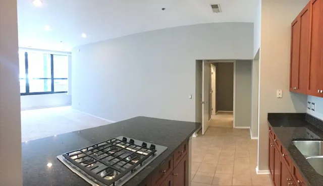 a kitchen with a stove and a refrigerator