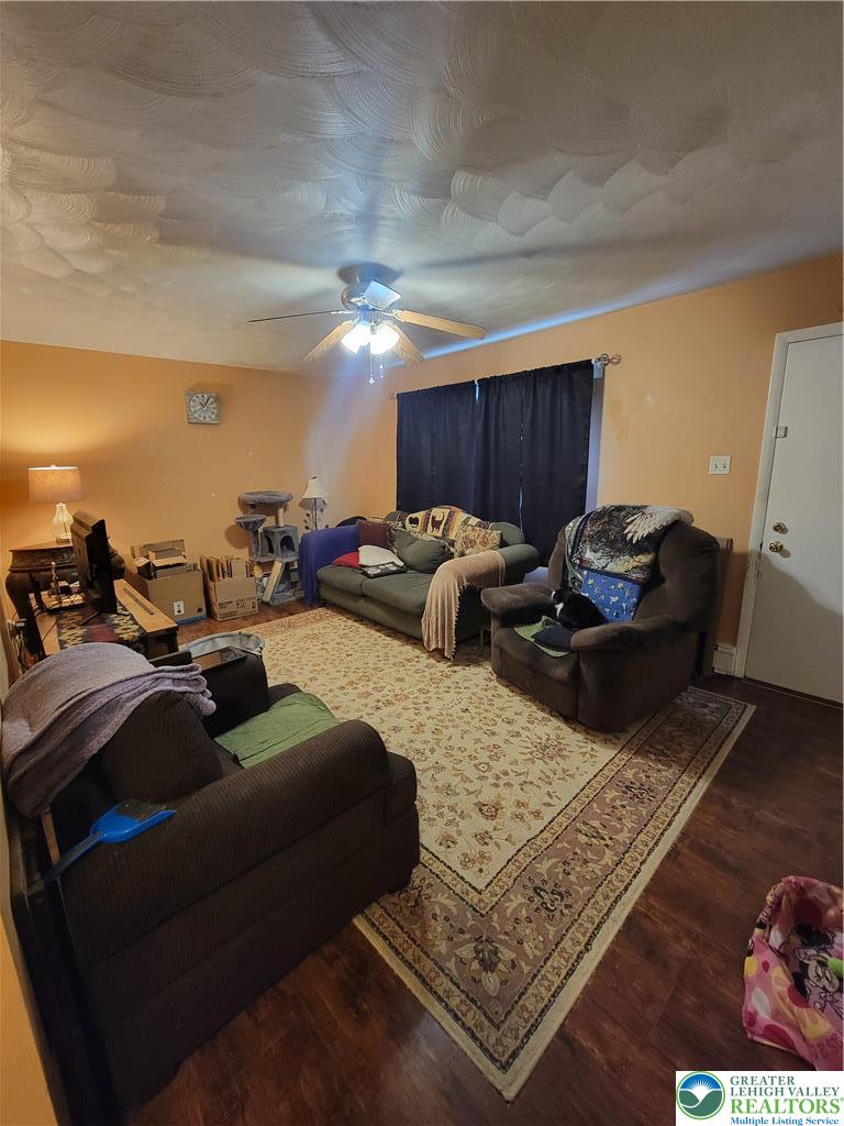 320 Hillside Street Forest City, PA 18421 - Photo 8 of 24 a living room with furniture and a lamp