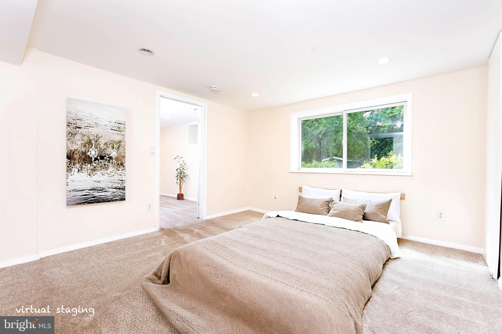 1418 Thornden Road Rockville, MD 20851 - Photo 10 of 19 a bedroom with a bed and a window