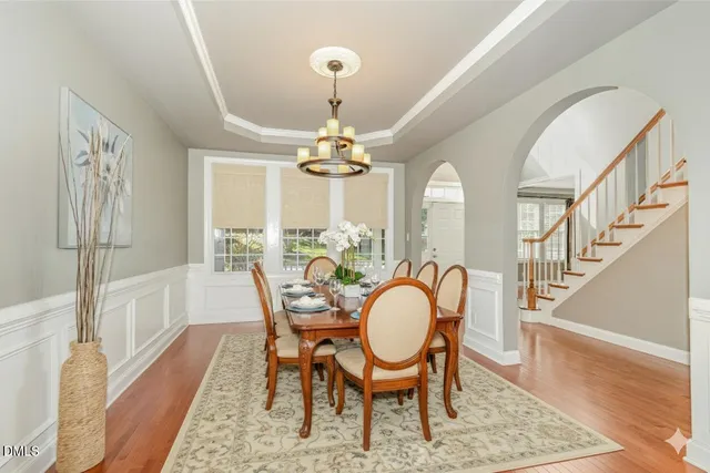 a bedroom with a bed and a ceiling fan
