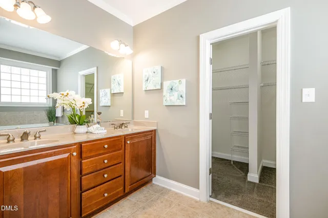 a spacious bathroom with a tub shower and sink