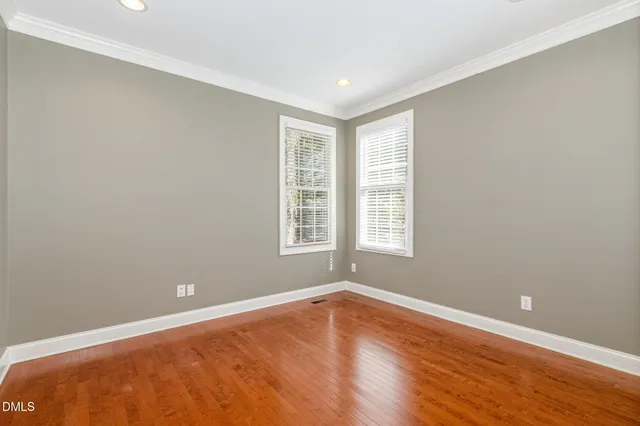 a view of entryway with wooden floor and door
