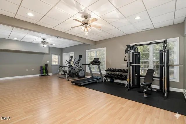 a terrace view with couple of couches and potted plants