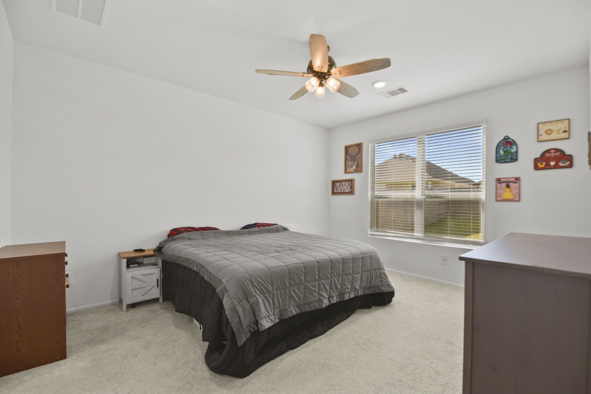 2851 Paradise Ridge Way Conroe, TX 77301 - Photo 13 of 33 a bedroom with a bed and window
