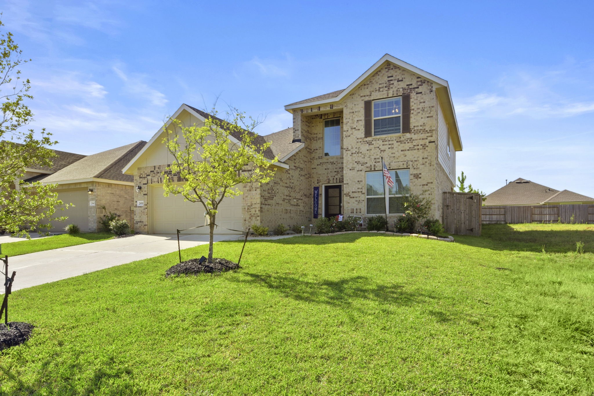2851 Paradise Ridge Way Conroe, TX 77301 - Photo 2 of 33 a house view with a garden space