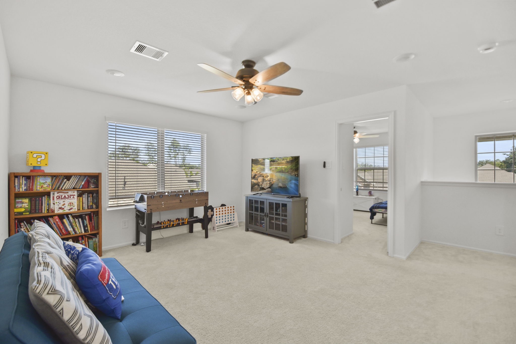2851 Paradise Ridge Way Conroe, TX 77301 - Photo 21 of 33 a living room with furniture and a flat screen tv
