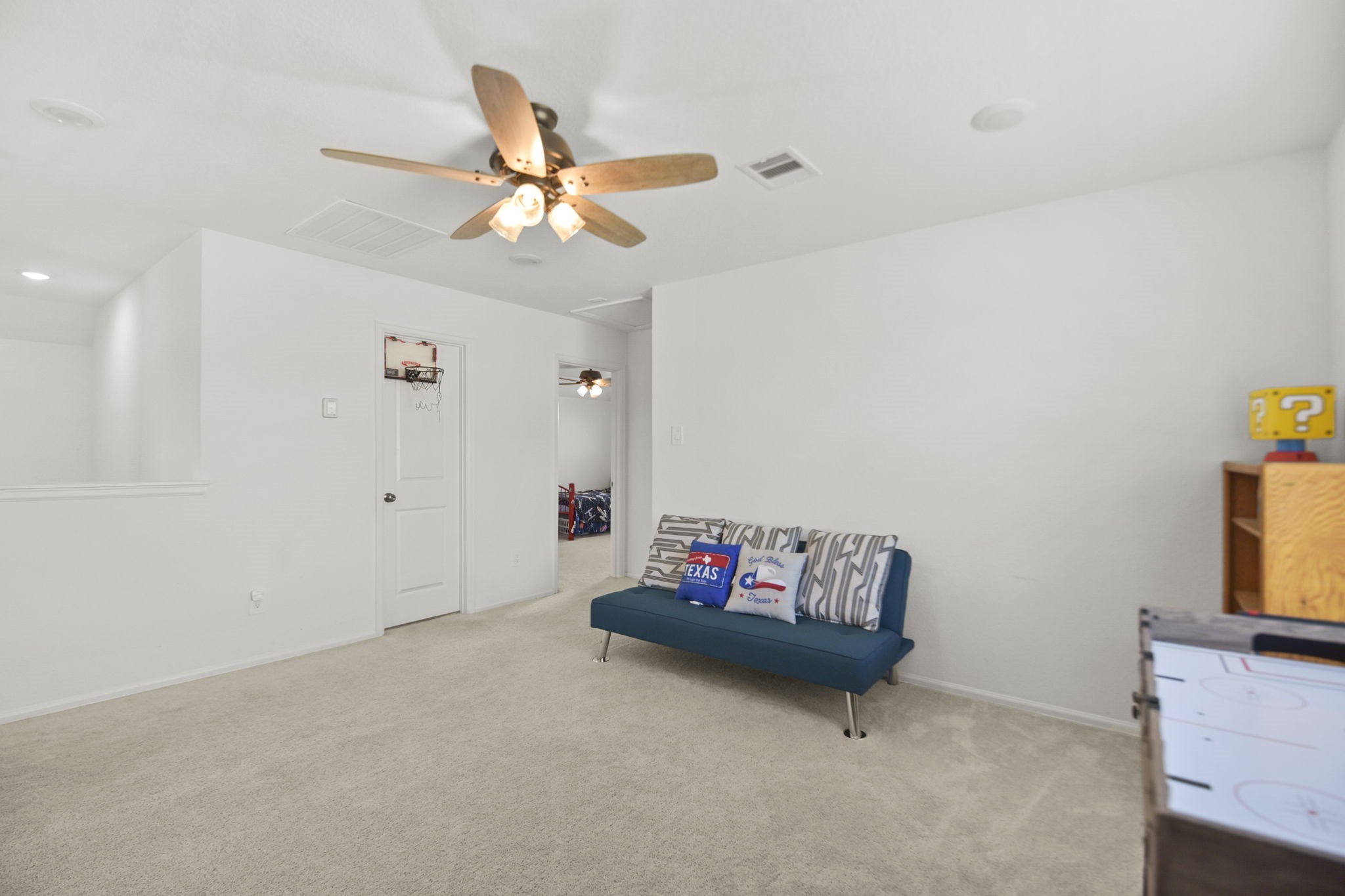 2851 Paradise Ridge Way Conroe, TX 77301 - Photo 23 of 33 a living room with furniture and a flat screen tv