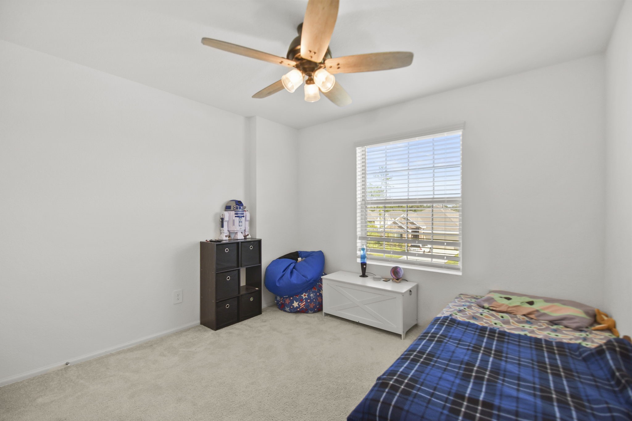 2851 Paradise Ridge Way Conroe, TX 77301 - Photo 24 of 33 a bedroom with bed and a window