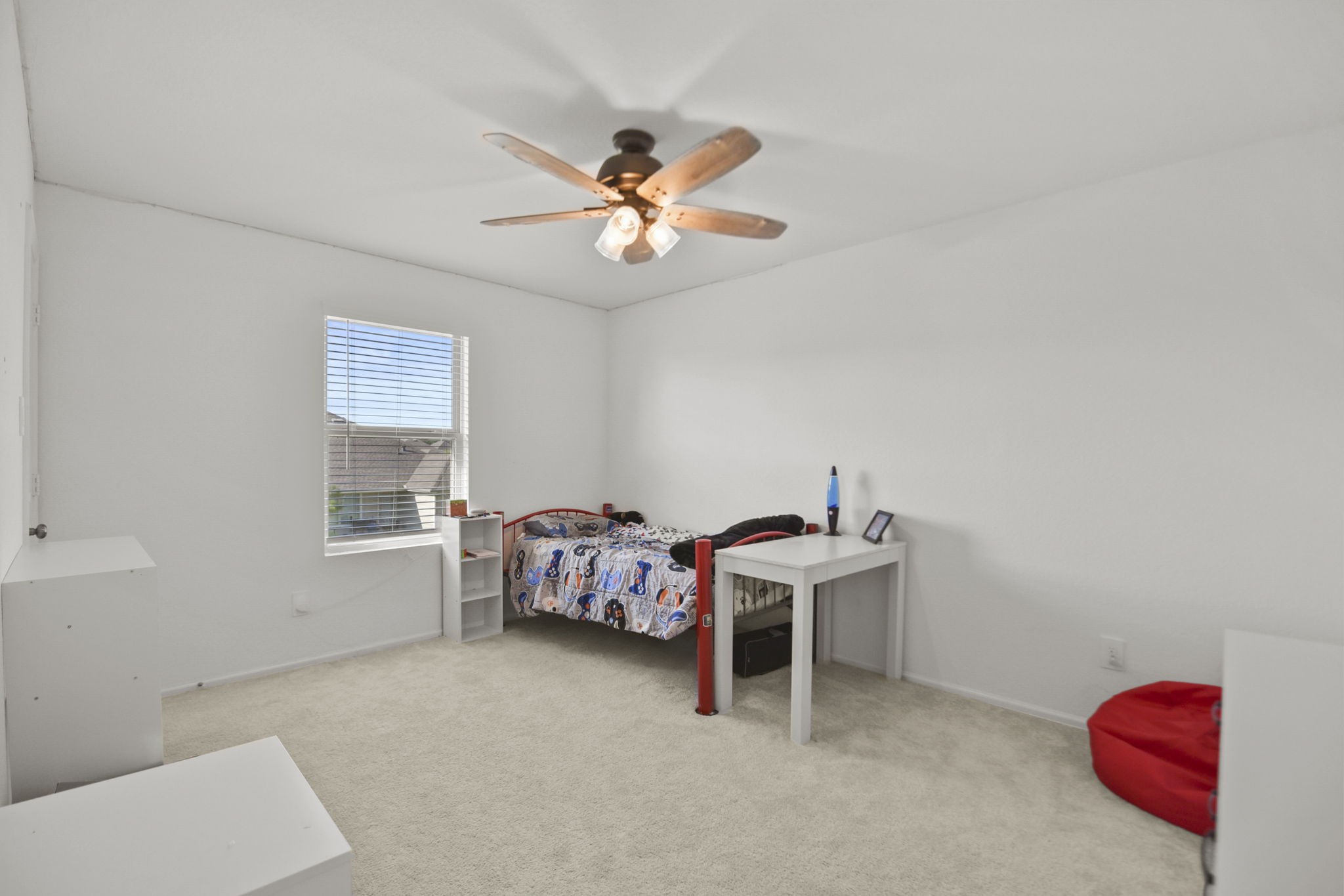 2851 Paradise Ridge Way Conroe, TX 77301 - Photo 26 of 33 a view of a workspace with furniture and a fan