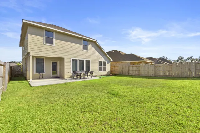 a front view of house with yard and seating area