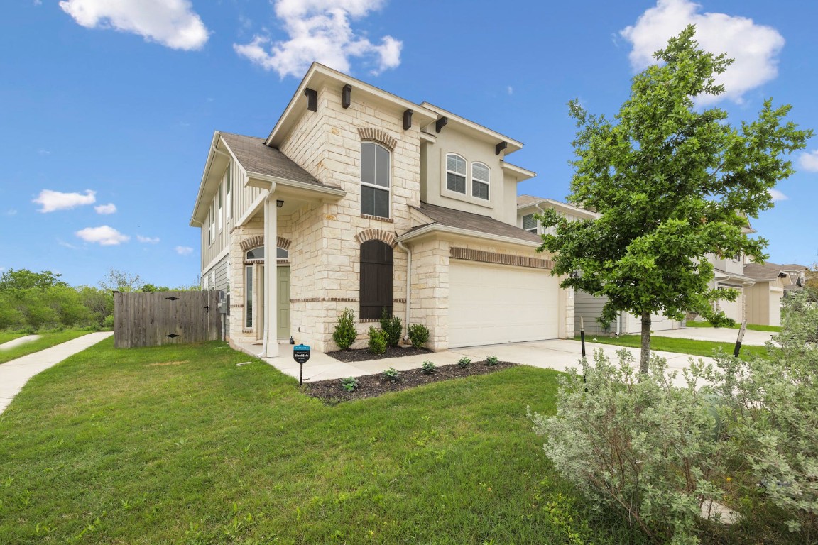a front view of a house with a yard