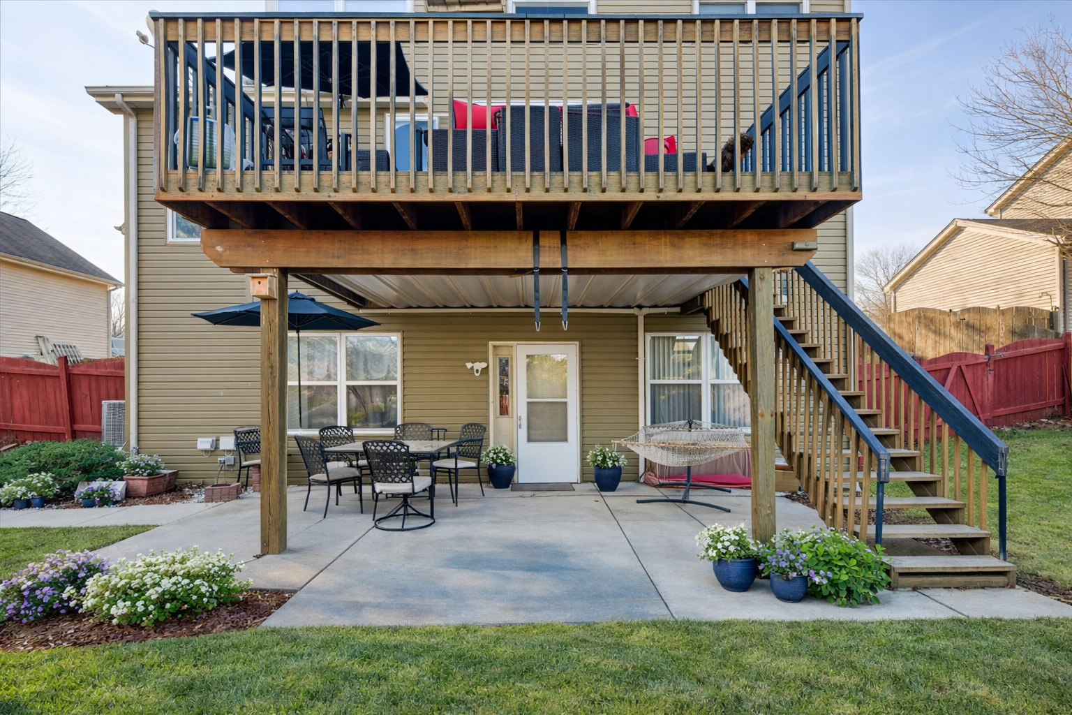 821 Red Barn Lane Elgin, IL 60124 - Photo 23 of 27 a view of a house with wooden deck and furniture