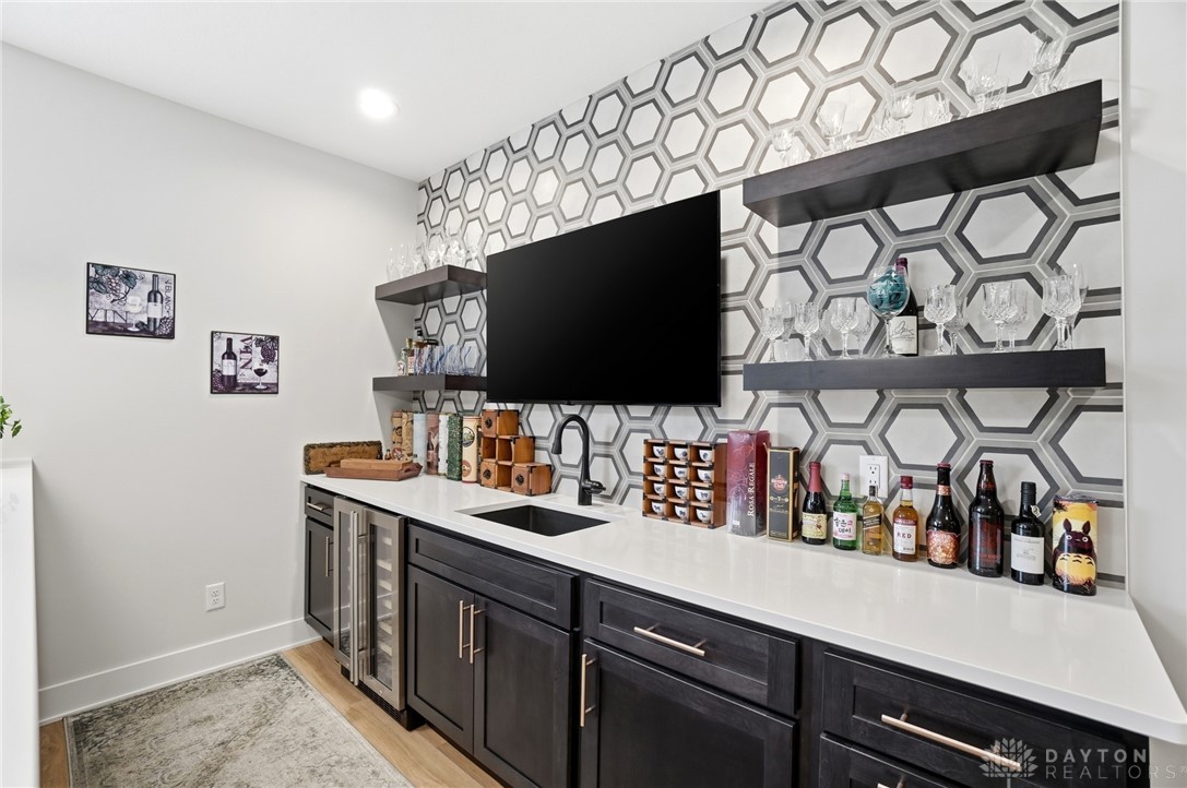 1247 Normandy Rue Dayton, OH 45458 - Photo 48 of 76 This sleek bar area features a contemporary design, offering both style and functionality for entertaining.