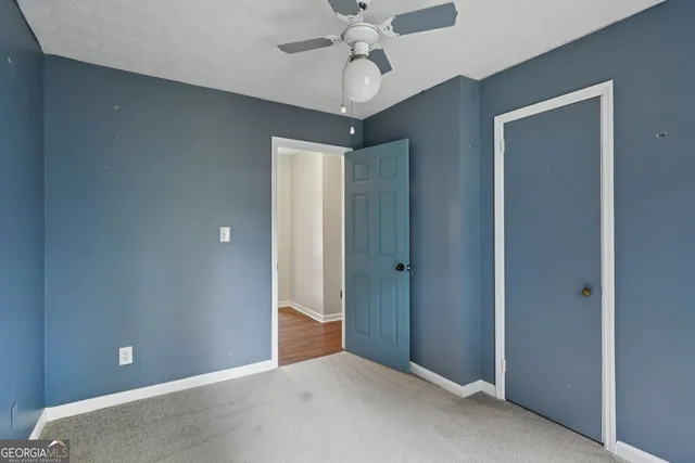 a view of a chandelier fan in a room
