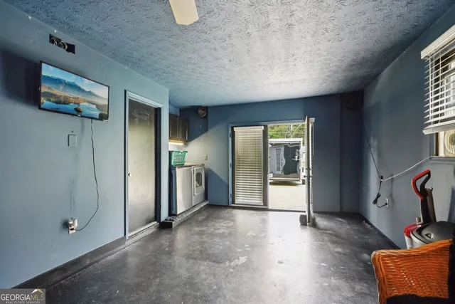 a view of livingroom with furniture and windows