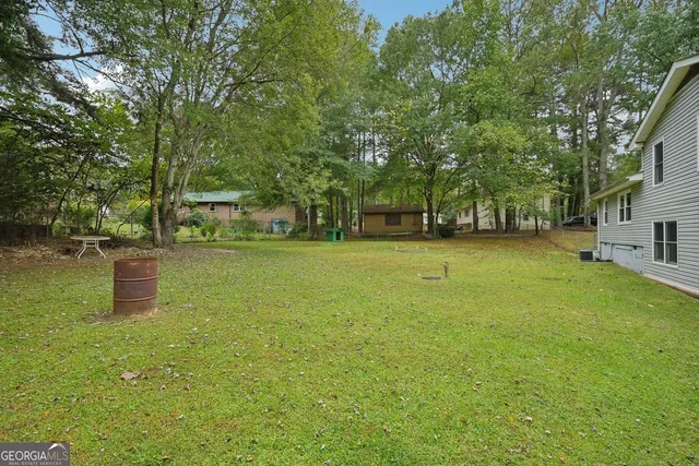 a backyard of a house with lots of green space