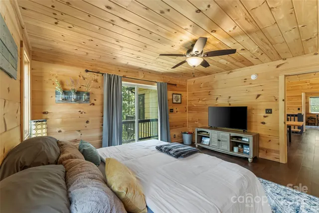 a en suite bathroom with a granite countertop sink and a mirror