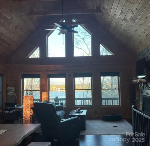 a view of mountain with sunset in background