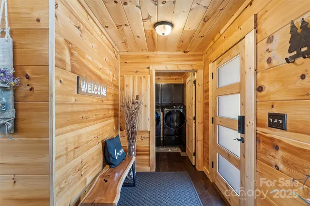 a view of a patio with dining table and chairs with wooden floor and fence