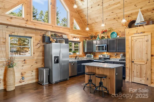 a living room with fireplace furniture and a flat screen tv