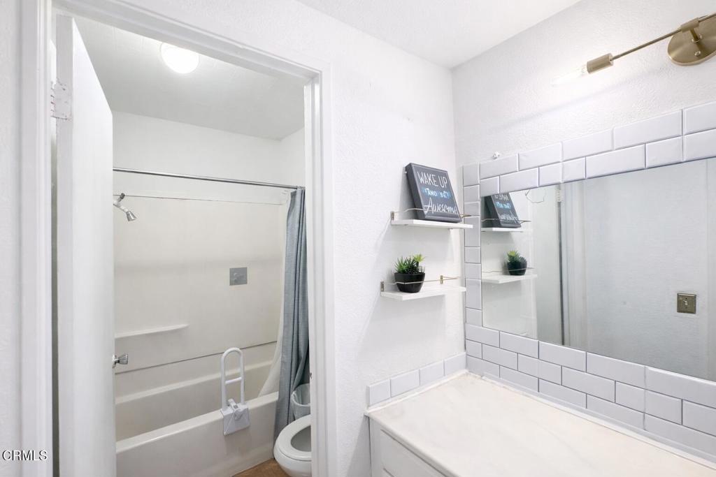 1440 Nelson Place Oxnard, CA 93033 - Photo 5 of 7 a bathroom with a bathtub shower sink and toilet