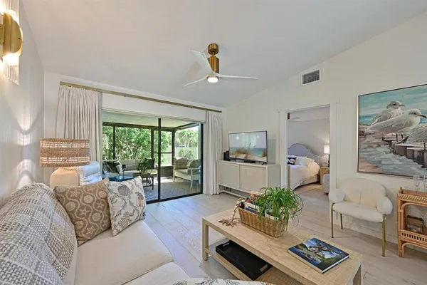 a living room with furniture and a window