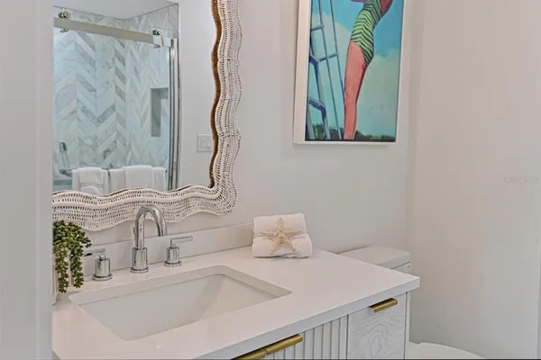 a bathroom with a sink and a mirror