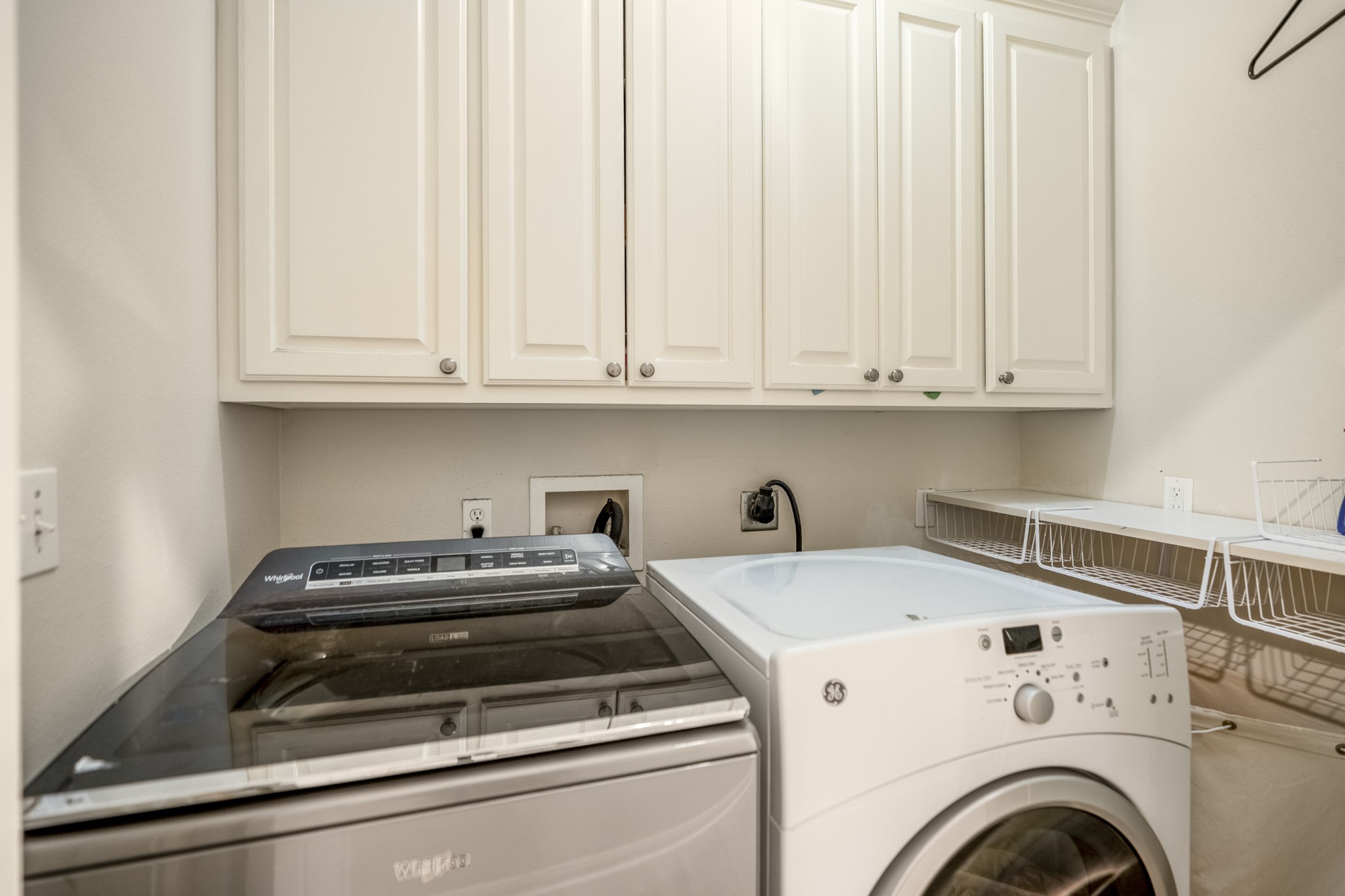 4236 Drake Street Houston, TX 77005 - Photo 30 of 43 The laundry room is conveniently located along the second-floor hallway for effortless access from all bedrooms.