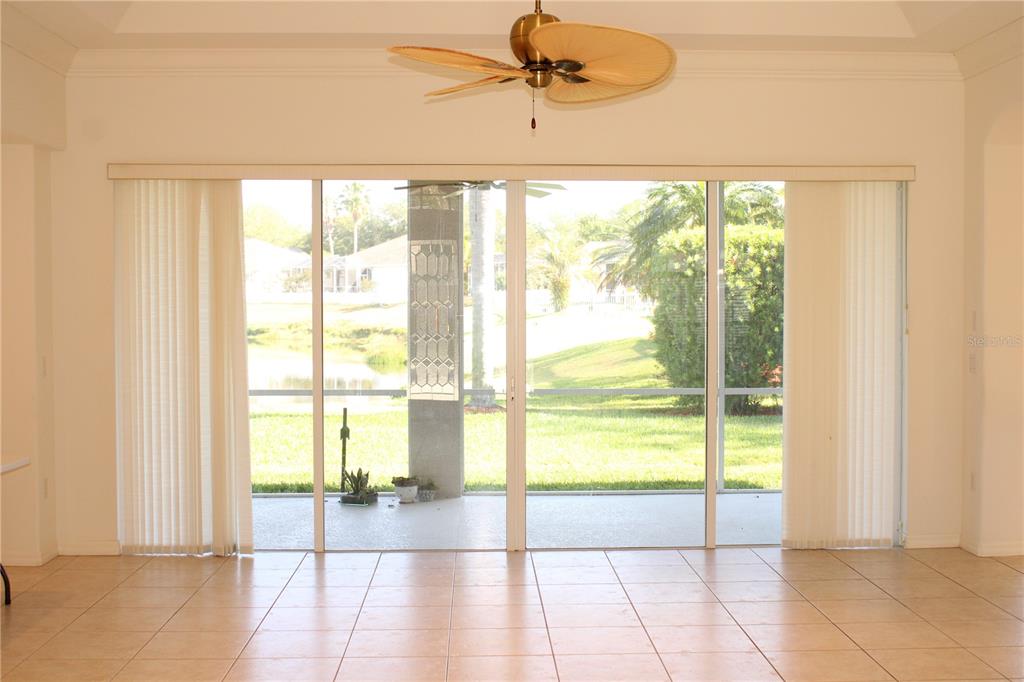 11257 28th St Circle East Parrish, FL 34219 - Photo 11 of 59 a view of an empty room and window a ceiling fan