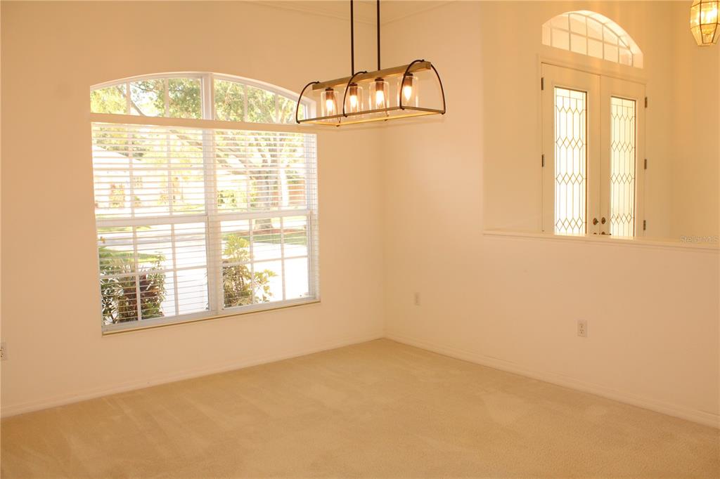 11257 28th St Circle East Parrish, FL 34219 - Photo 17 of 59 an empty room with windows and outdoor view