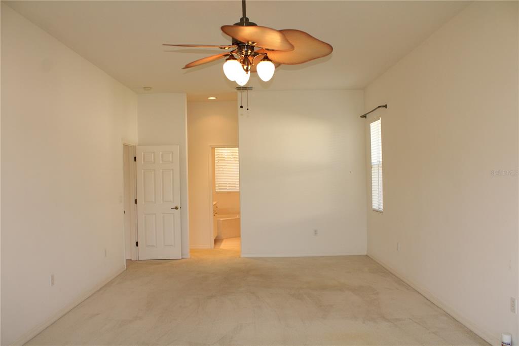 11257 28th St Circle East Parrish, FL 34219 - Photo 19 of 59 a view of an empty room with a window