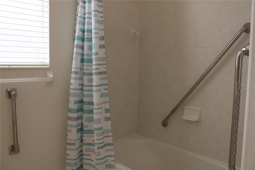 11257 28th St Circle East Parrish, FL 34219 - Photo 32 of 59 a bathroom with a shower