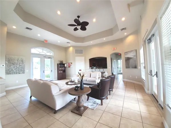 a living room with furniture and a large window
