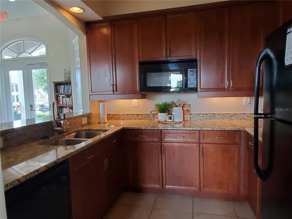 a kitchen with a sink and cabinets