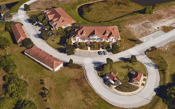 an aerial view of a house with a swimming pool