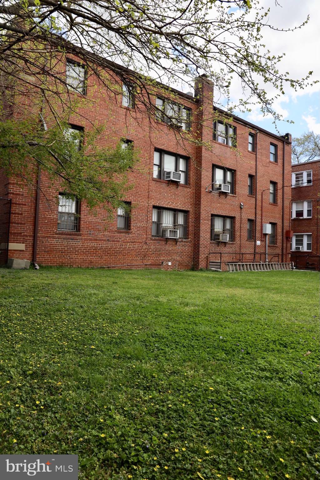 5204 3rd Street Northwest, Unit 3 Washington, DC 20011 - Photo 9 of 9 front view of a building with a yard