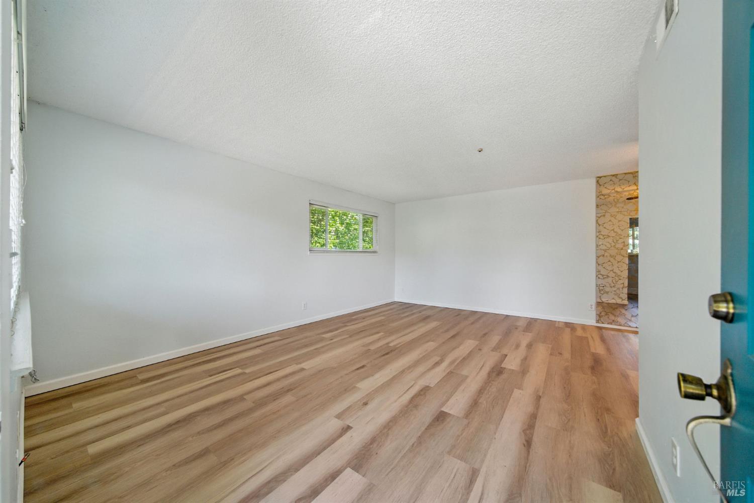 1890 Dorado Court Santa Rosa, CA 95403 - Photo 7 of 25 a view of an empty room with a window
