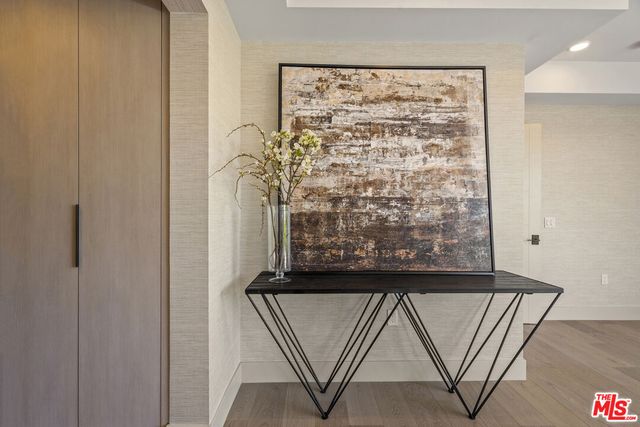 a bathroom with a granite countertop sink mirror and a shower
