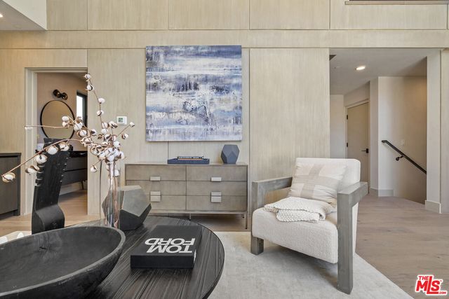 a bathroom with a toilet and a mirror