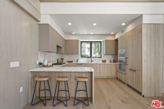 a kitchen with sink cabinets and window