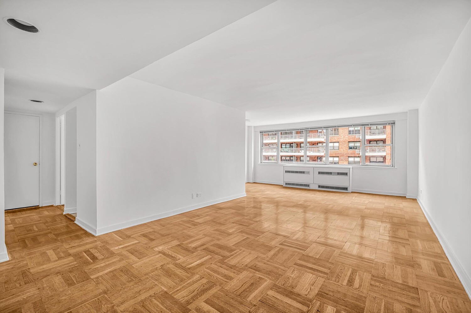 233 East 70th Street, Unit 10T Manhattan, NY 10021 - Photo 3 of 14 a view of an empty room and window