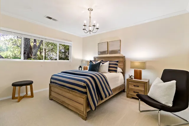 a spacious bedroom with a bed and window