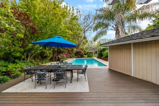 an outdoor space with furniture and umbrella