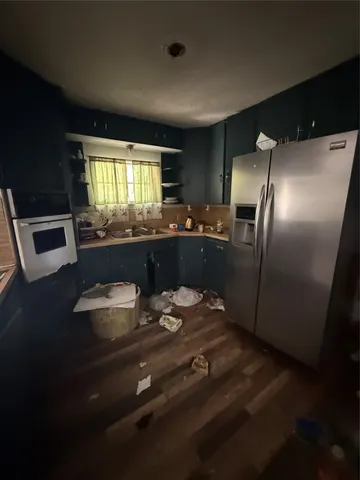 a kitchen with a table and chairs in it