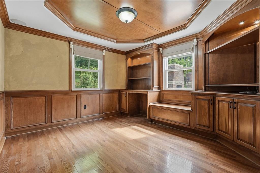 809 Franklin Road Mars, PA 16046 - Photo 20 of 44 Wood-paneled den with built-ins — ideal office or guest room