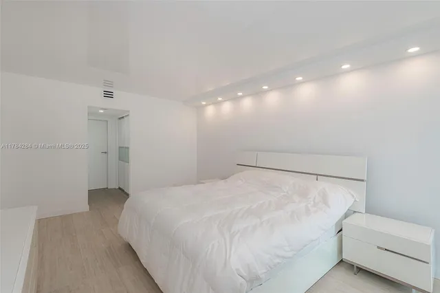 a bathroom with a granite countertop sink a toilet and a mirror