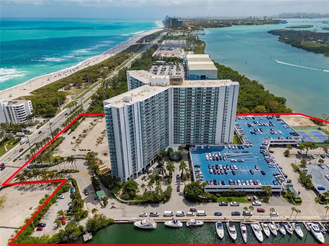 a view of roof deck with wooden wall and outdoor seating