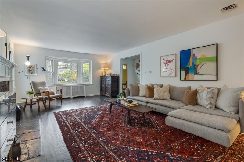 8 Lessing Road West Orange, NJ 07052 - Photo 15 of 40 a living room with furniture and a wooden floor
